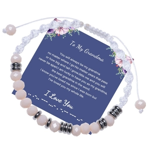 Detail of I Love You Morse code bracelet with pink crystal beads on a message card