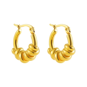 Detail of gold hollow hoop earrings with thick knotted design and polished finish