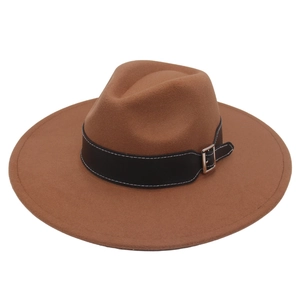 Detail of dark brown felt fedora hat featuring a black leather belt with silver metal buckle