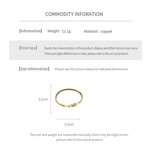 Size chart showing 5.5cm inner diameter and 12.1g weight for the gold cross cuff bracelet