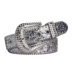 Detail of silver rhinestone belt with sparkling sequins and Western style metal buckle