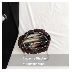 Top view of brown pleated bucket bag interior showing large storage capacity for essentials