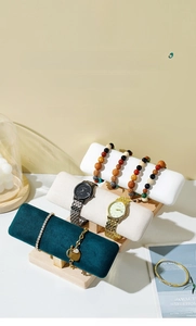 Three-tier wood bracelet display stand with velvet and leather textured rollers