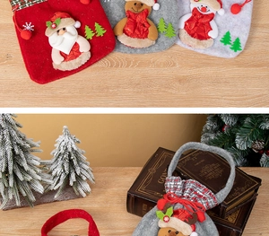 Detailed view of Christmas felt gift bags featuring 3D Santa, reindeer and snowman designs