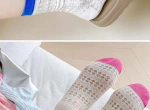 Detail view of mesh lace crew socks in blue and pink colors with intricate floral patterns