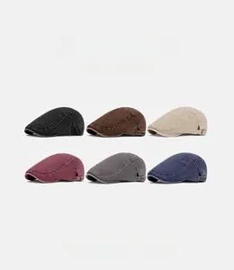 Detailed grid showing six assorted colors of washed denim flat caps with metal buckles