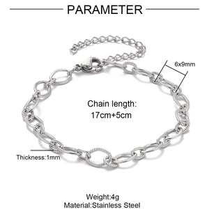 Macro detail of silver stainless steel paperclip chain with textured links and lobster clasp