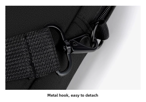Detail of durable black metal swivel hook and high-density nylon strap for laptop bag