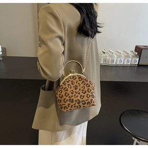 Chic leopard print shell clutch bag featuring golden metal handle and chain shoulder strap
