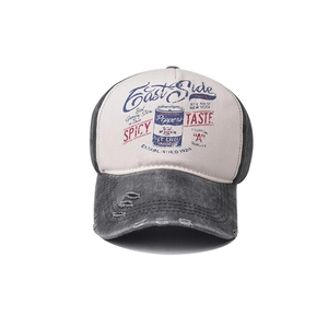 Close-up of distressed brim and retro spice logo on vintage washed cotton baseball cap