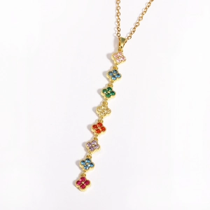 Detailed view of long gold chain necklace featuring eight multi-colored clover pendants