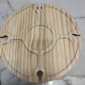 Macro view of partitioned pine wood picnic snack tray and built-in wine glass holders