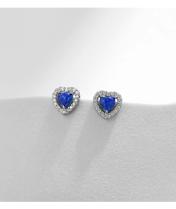 Macro shot of S925 silver heart stud earrings with blue opal and halo zircon stones