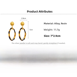 Detailed view of leopard resin earrings showing 7x2.9cm dimensions and 11.7g weight
