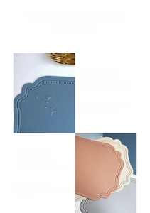 Detail of scalloped edge faux leather placemats with waterproof embossed texture