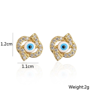 Detail shot of 18K gold evil eye earrings with zircon inlay and size dimensions