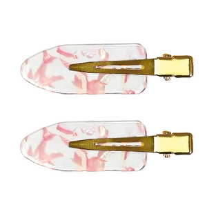 Set of two pink cherry blossom resin hair clips with elegant gold metal fasteners