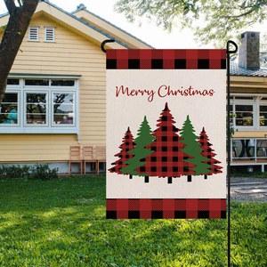 Merry Christmas garden flag with red buffalo plaid trees in a winter yard setting