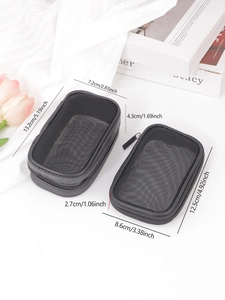 Detail of two black mesh travel pouches showing breathable texture and dimensions