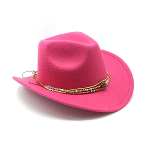 Detail of rose red wool western cowboy hat with bohemian ethnic beaded decorative band