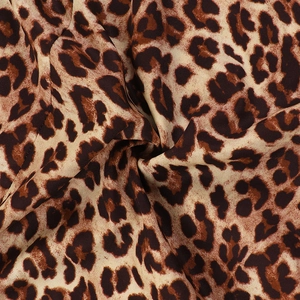 Macro shot of leopard print fabric showing texture and soft drape for long dress