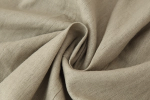 Detailed macro texture of light brown linen fabric with natural weave and soft folds