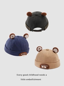 Detailed corduroy texture and bear ear design on kids dockers caps in three colors