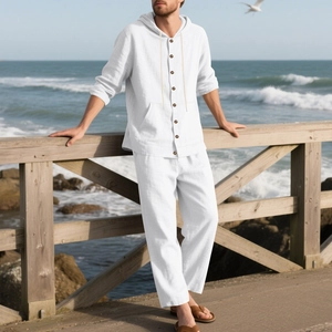Detail of white linen beach set texture on long sleeve hooded shirt and trousers
