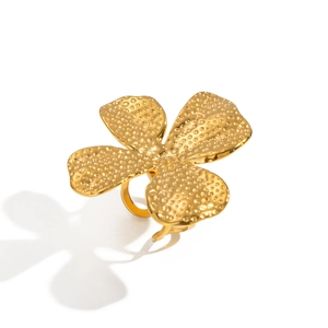 Detailed close-up of a gold flower ring with vintage hammered metal texture and 3D petals