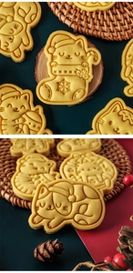 Close-up of golden baked cookies with cute cartoon Christmas cat shapes and clear textures