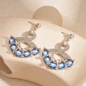 Vintage silver earrings with blue crystal drops and sparkling geometric rhinestones