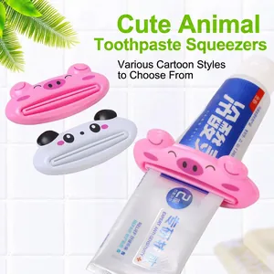 Cartoon animal toothpaste squeezer featuring pig and panda designs for bathroom use