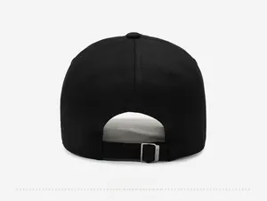 Close-up of black cotton baseball cap back with adjustable webbing and metal buckle