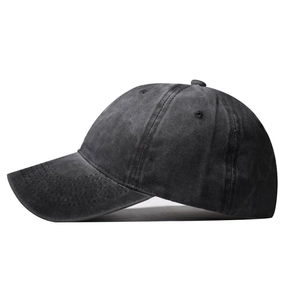 Close-up of side view showing washed cotton texture and stitching of dark gray baseball cap