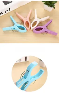 Detail of colorful plastic laundry pegs with strong metal springs for quilts