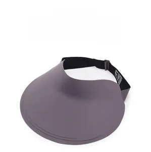 Detail view of foldable dark grey sun visor with adjustable strap and internal wash label