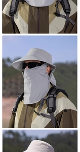 Détail du chapeau de soleil gris avec filet respirant et masque de protection amovible