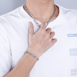 Men's silver stainless steel 10mm twisted curb chain necklace and bracelet set on model