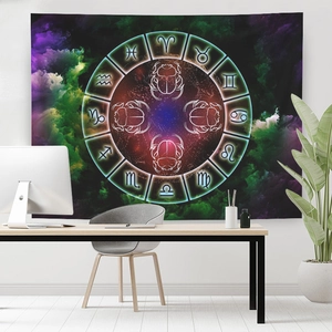 Zodiac signs tapestry with beetle design hanging in a cozy home office setting