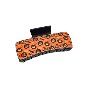 Gothic Halloween hair claw clip with orange pumpkin and Trick or Treat patterns