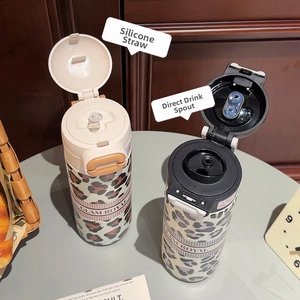Dual-lid leopard print tumbler featuring silicone nozzle and direct drinking mouth design