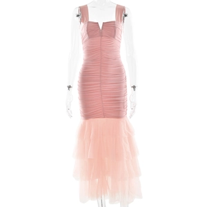 Detailed view of the pink V-neck dress featuring a pleated bodice and layered mesh fishtail hem