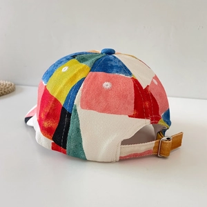 Kids baseball cap with colorful patchwork design and adjustable gold metal buckle back