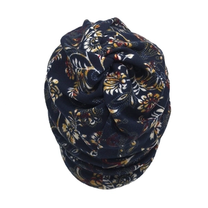 Floral print knit beanie in navy blue with vintage pattern and top knot detail