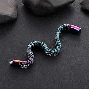 Detail of rainbow braided titanium steel bracelet with magnetic clasp on black stone