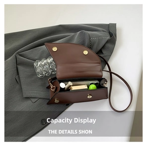 Detail showing internal capacity of the brown crocodile pattern bag for daily essentials