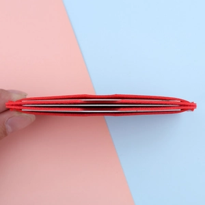 Slim red minimalist wallet with three card slots for ID and credit cards