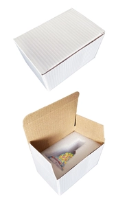 Detailed view of rainbow wind chime safely packed in a white cardboard box with foam liner