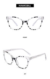 Front and 45-degree views of stylish cat-eye glasses with transparent hawksbill pattern