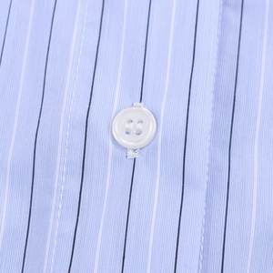 Close-up of blue striped shirt fabric with a white resin button and fine stitching